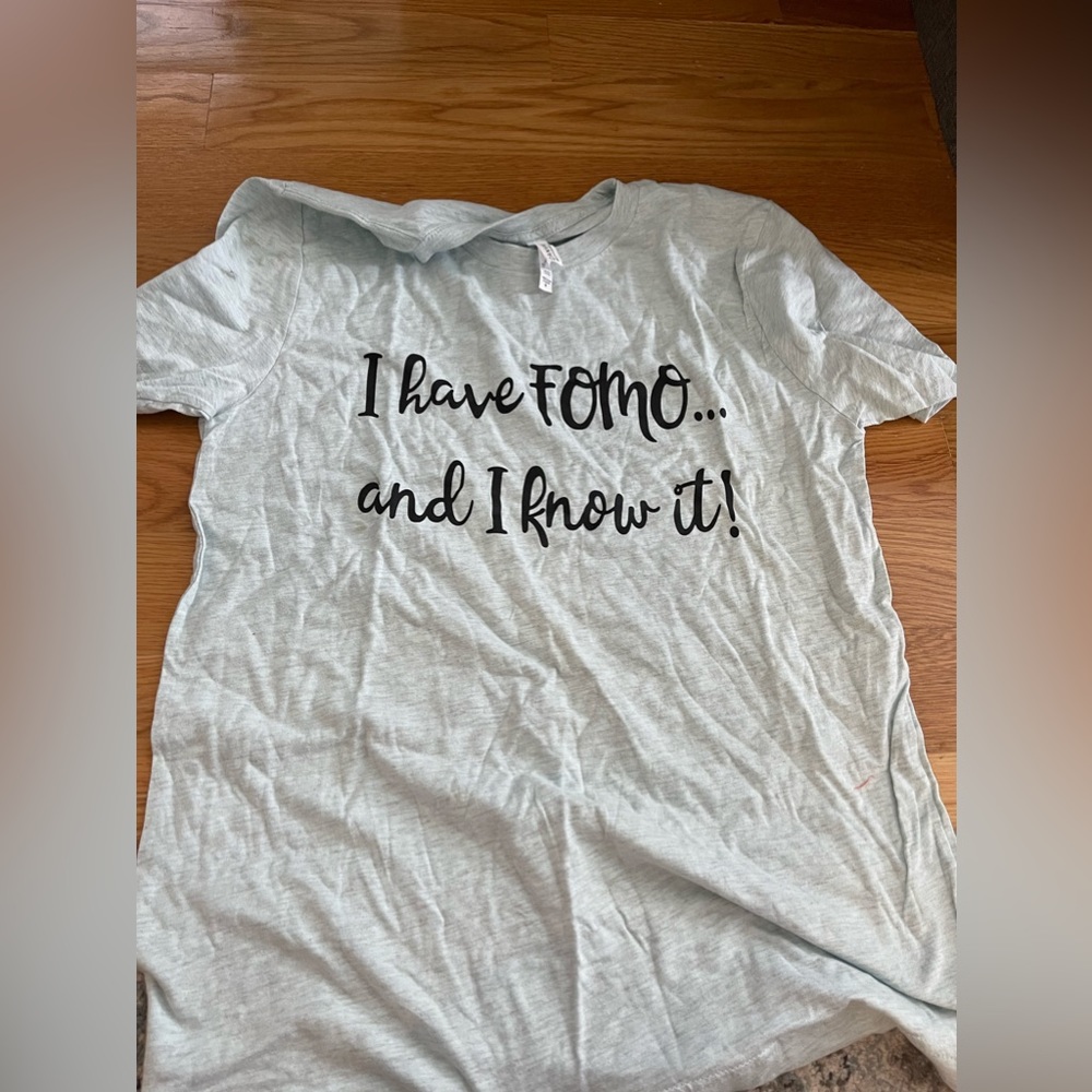 T shirt never worn - says “I have FOMO and I know it.”